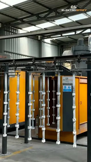 Tunnel-type automatic powder coating line in operation